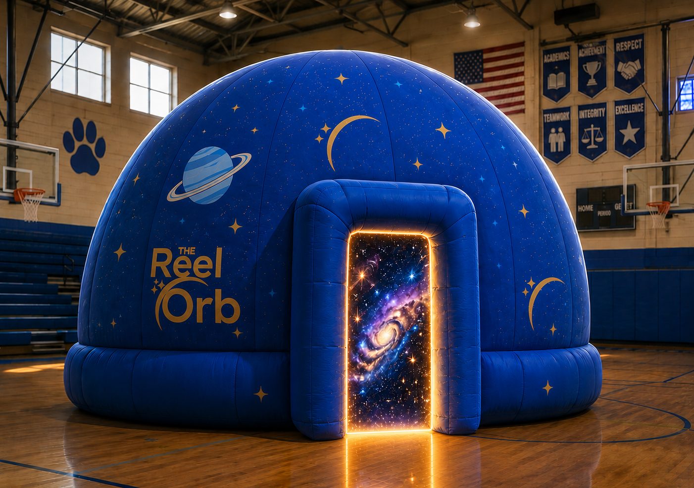 The Reel Orb inflatable planetarium dome set up in a school gymnasium
